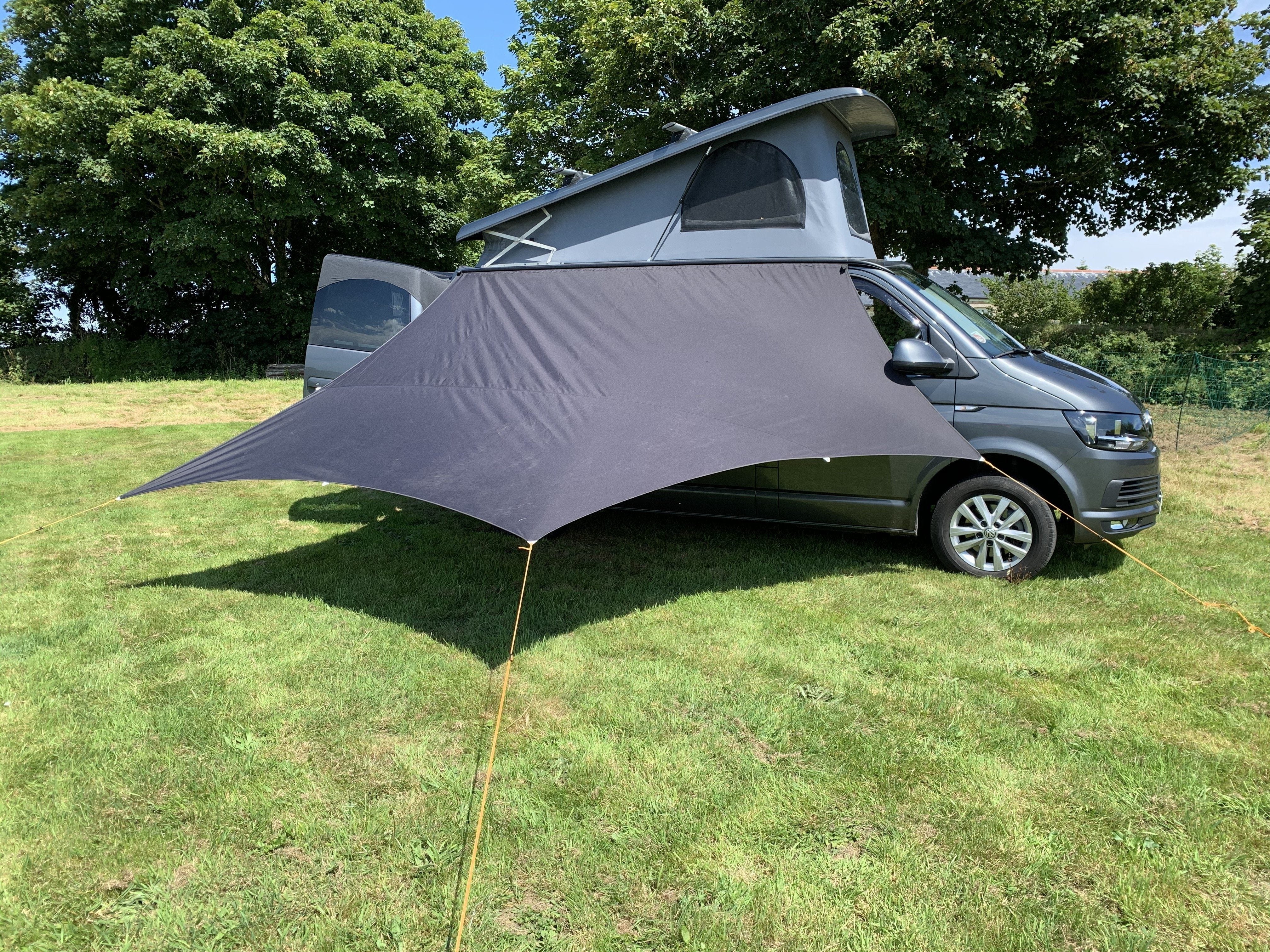 Camper van side outlet awning